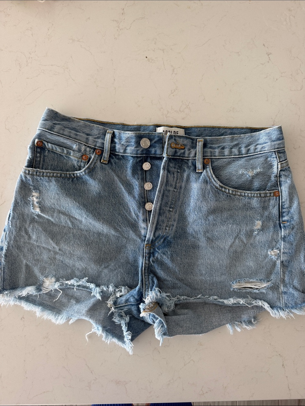 Agolde Light Wash Distressed Denim Cutoff Shorts